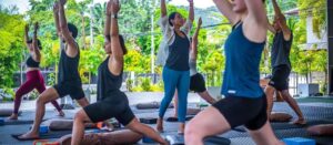 Group practicing yoga outdoors together